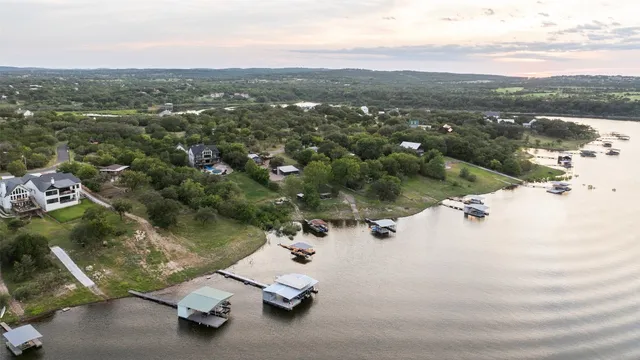 a room with gym equipment and large windows