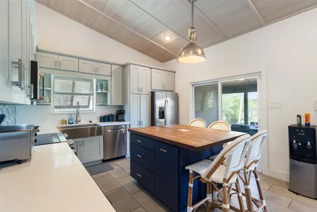 a view of a balcony with wooden floor and fence