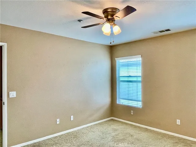 a view of a big room with windows