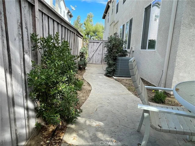 a view of backyard with potted plants
