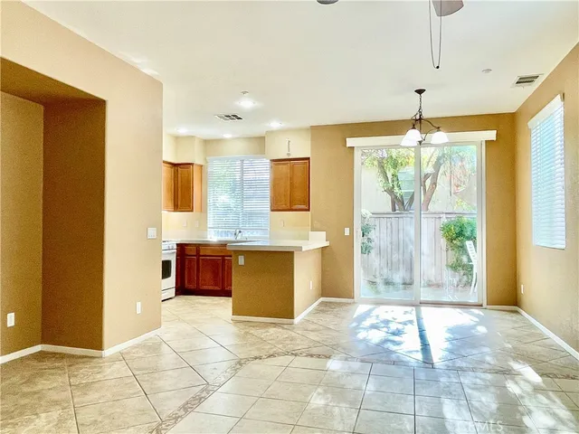 a spacious bathroom with a granite countertop sink a mirror and a shower