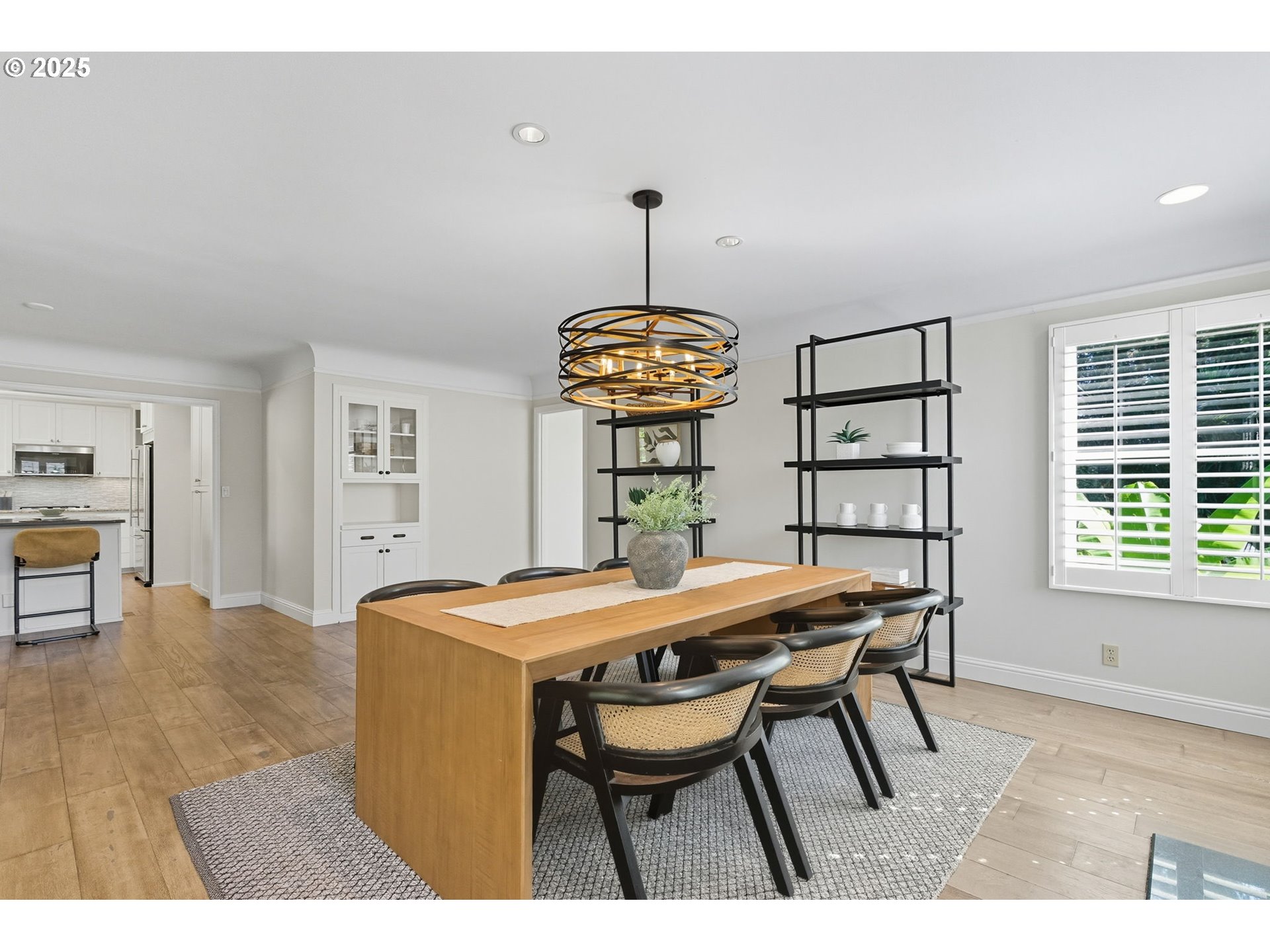 3190 Southwest Ridgewood Avenue Portland, OR 97225 - Photo 11 of 41 a dining room with a table chairs and a wooden floor