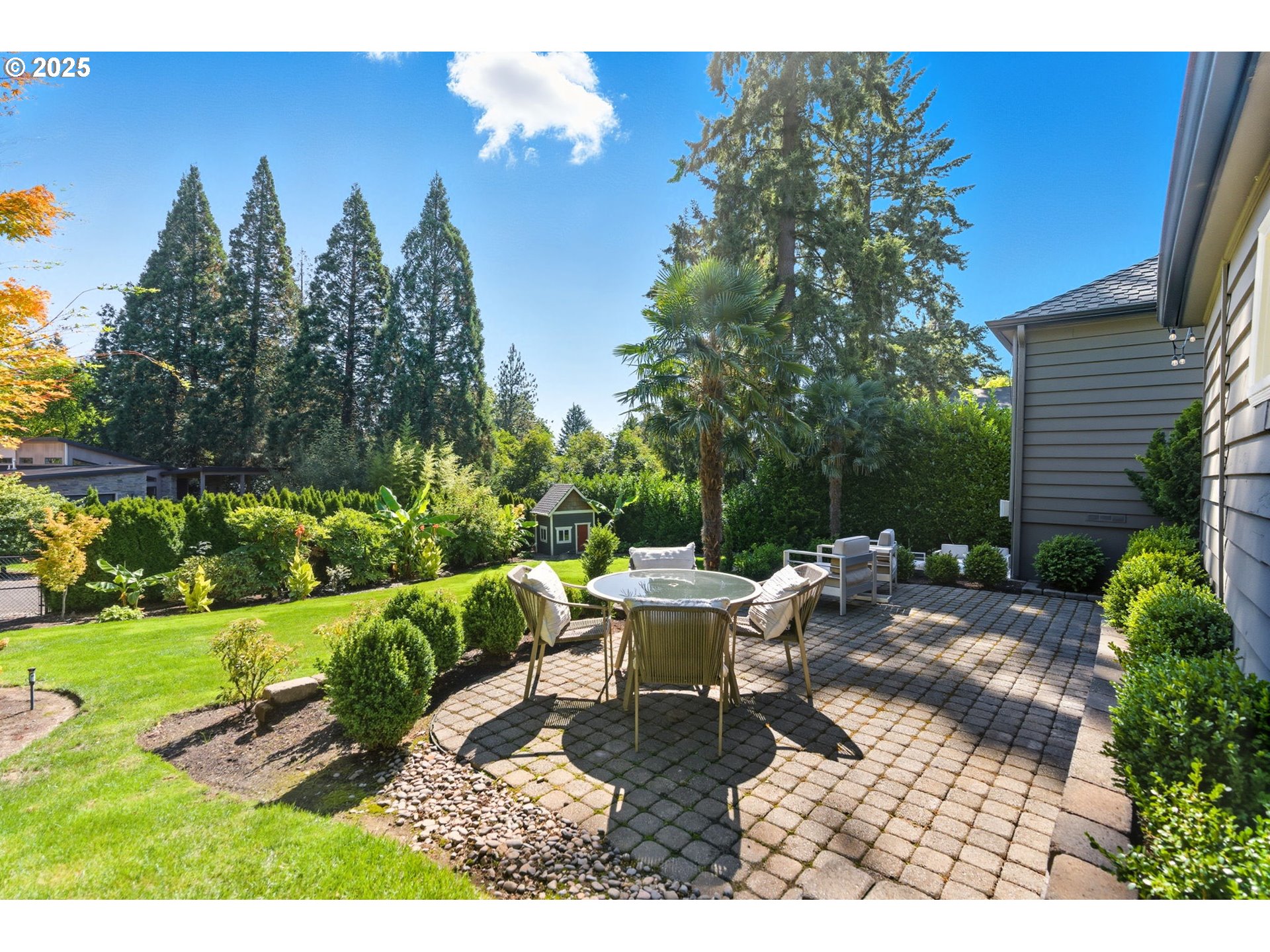 3190 Southwest Ridgewood Avenue Portland, OR 97225 - Photo 16 of 41 a view of a backyard with sitting area