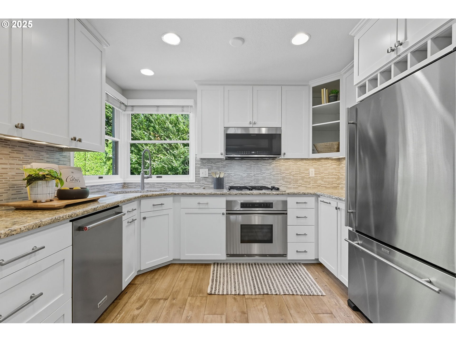 3190 Southwest Ridgewood Avenue Portland, OR 97225 - Photo 17 of 41 a kitchen with a sink stove and refrigerator