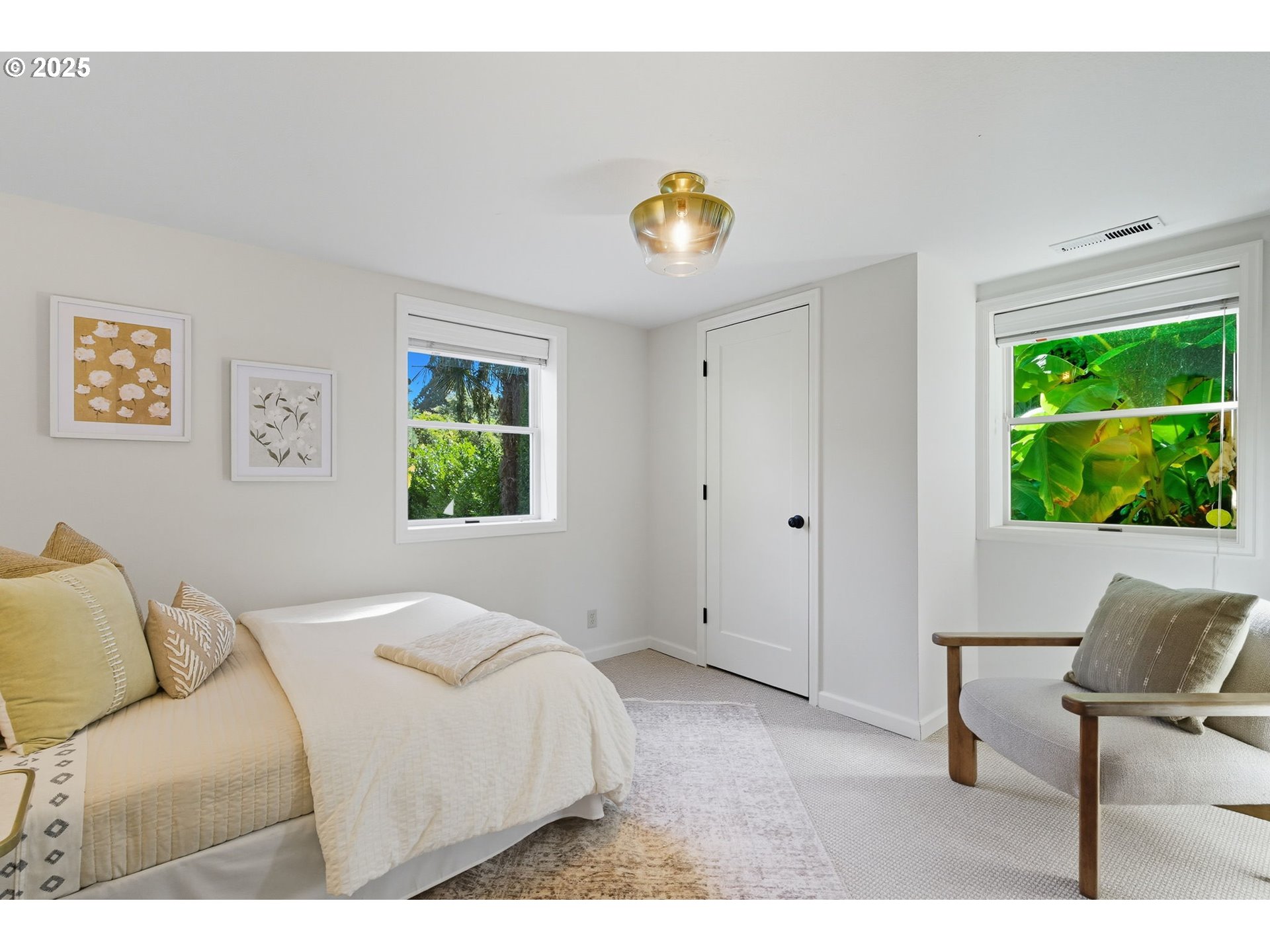 3190 Southwest Ridgewood Avenue Portland, OR 97225 - Photo 30 of 41 a bedroom with a bed and a window