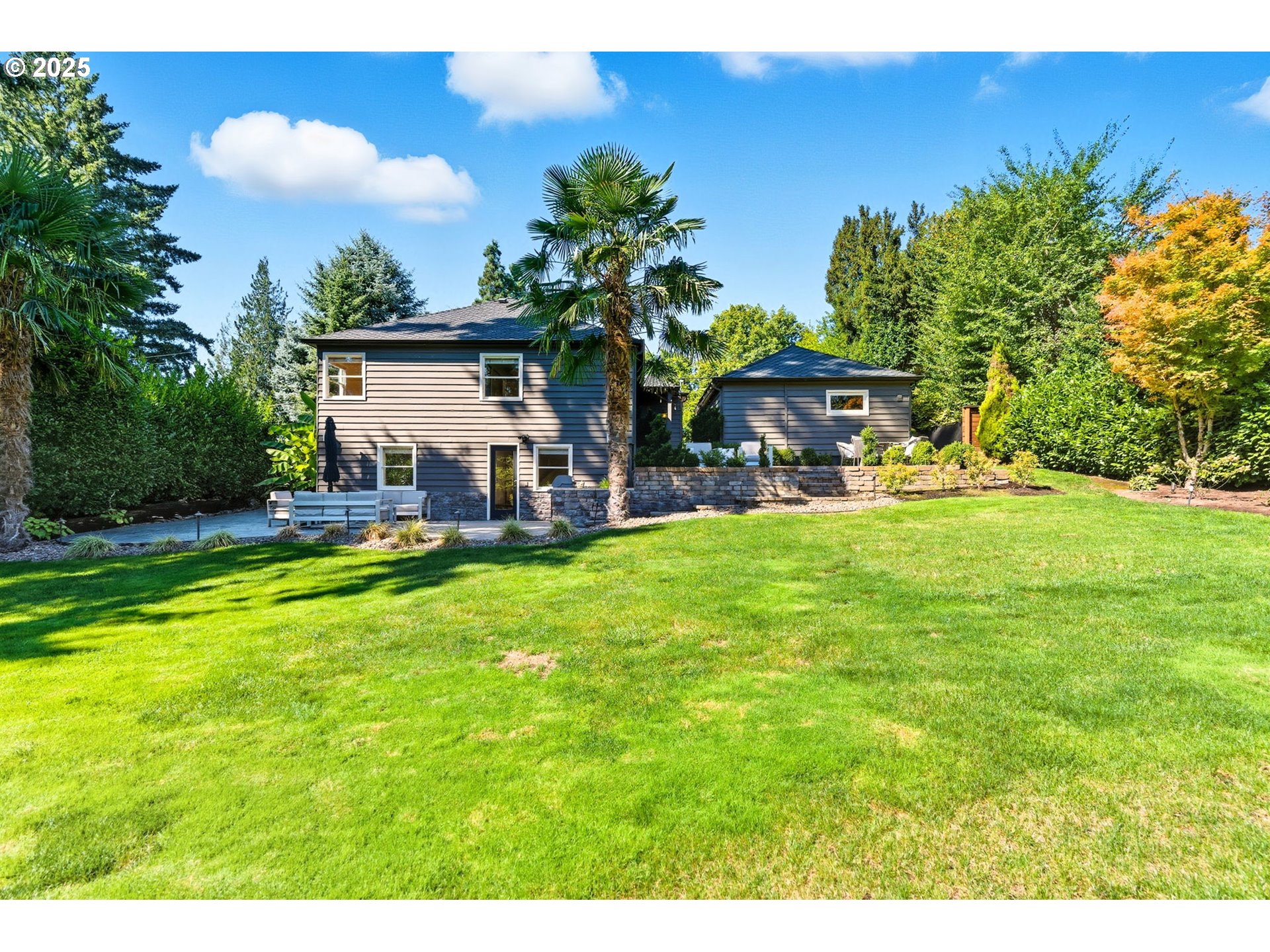 3190 Southwest Ridgewood Avenue Portland, OR 97225 - Photo 38 of 41 a view of a house with a yard porch and sitting area