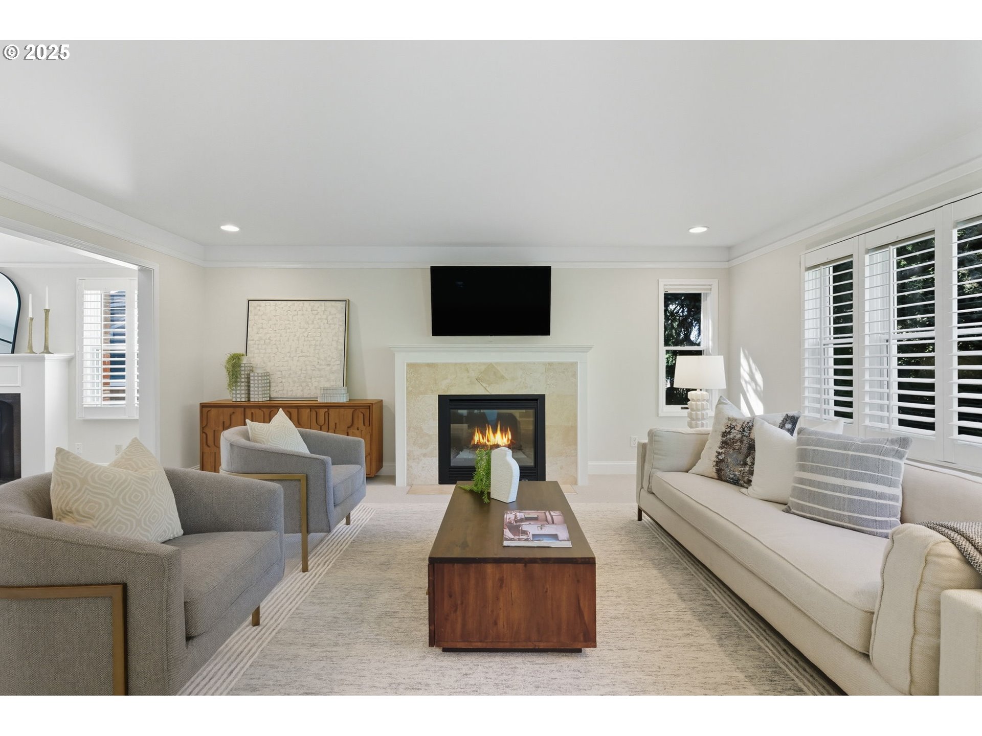 3190 Southwest Ridgewood Avenue Portland, OR 97225 - Photo 6 of 41 a living room with furniture a fireplace and a flat screen tv