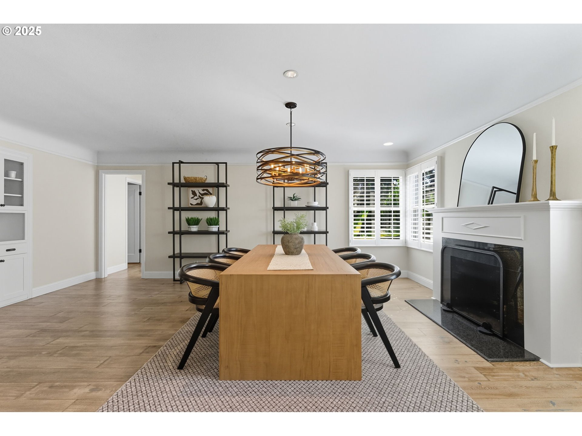 3190 Southwest Ridgewood Avenue Portland, OR 97225 - Photo 10 of 41 a living room with furniture a fireplace and a chandelier