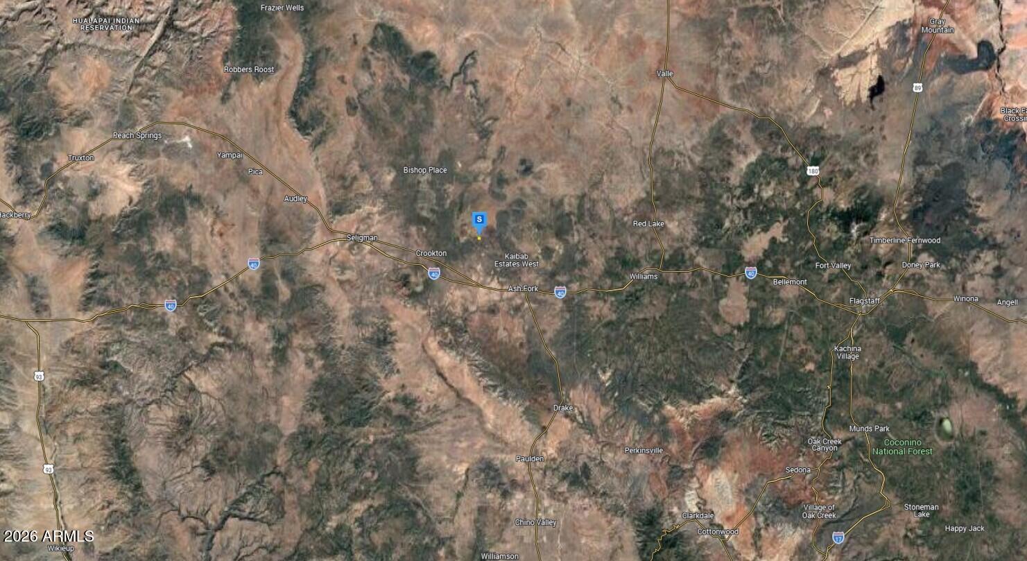 8602 North Ten Tanks Road, Unit 157 Williams, AZ 86046 - Photo 4 of 4 a view of a yard with a tree