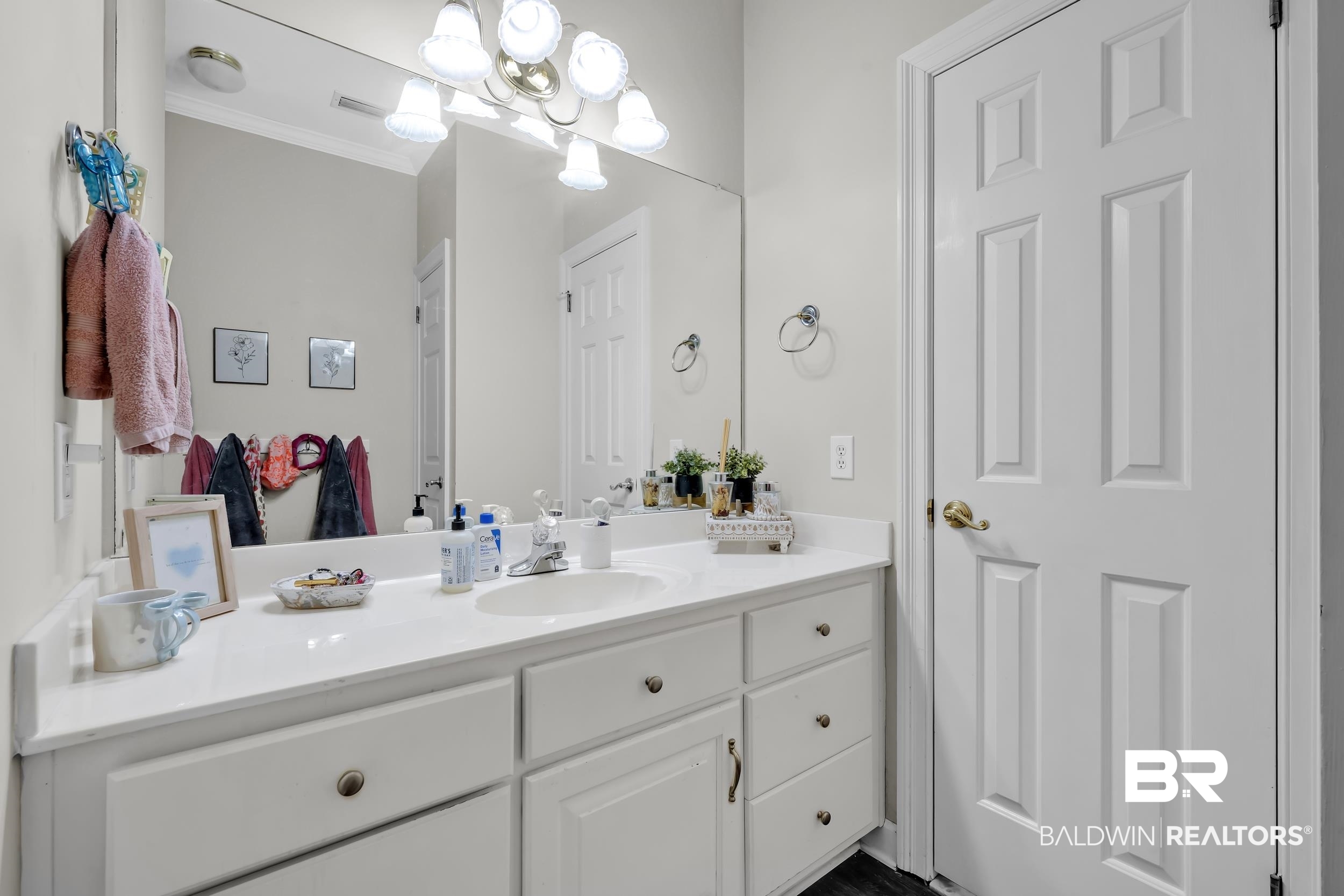 2858 Postoak Circle Mobile, AL 36693 - Photo 25 of 32 Bathroom featuring vanity, a chandelier, and crown molding
