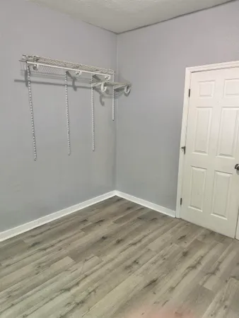 a view of an empty room with a window