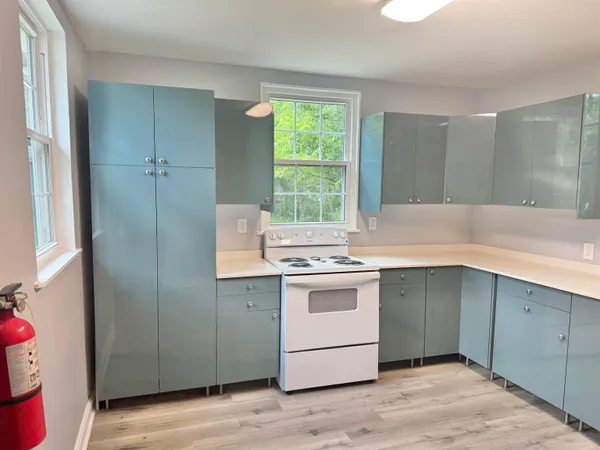 a kitchen with a stove and a sink