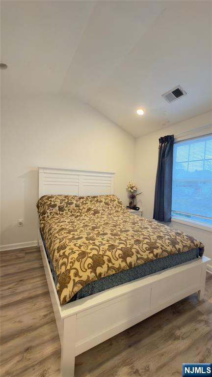 246 Harding Avenue Clifton, NJ 07011 - Photo 12 of 28 a bed sitting in a room next to a window