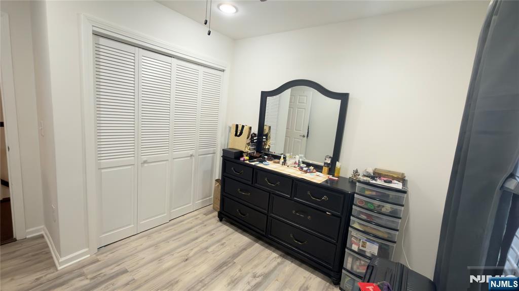 246 Harding Avenue Clifton, NJ 07011 - Photo 14 of 28 a room with a mirror and a dresser
