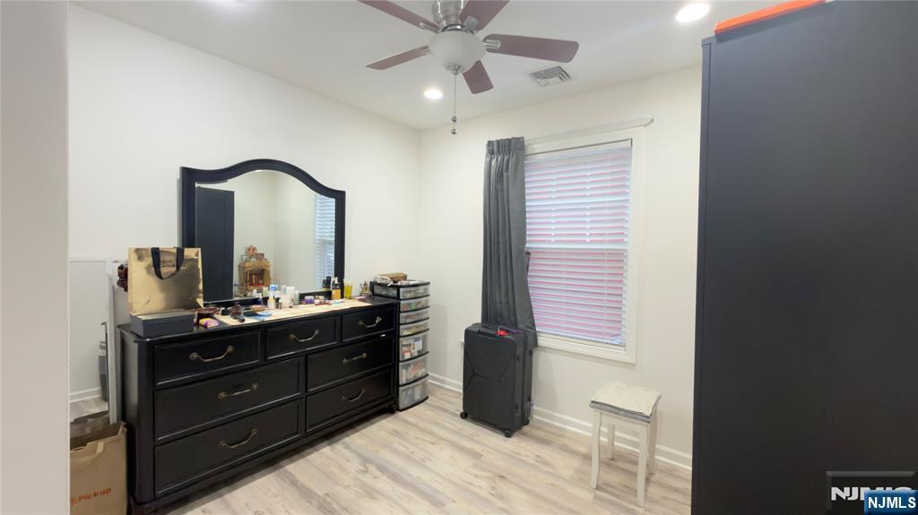 246 Harding Avenue Clifton, NJ 07011 - Photo 15 of 28 a room with a dresser and a mirror