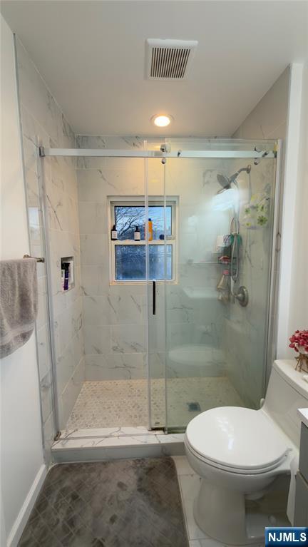 246 Harding Avenue Clifton, NJ 07011 - Photo 18 of 28 a bathroom with a toilet and a shower