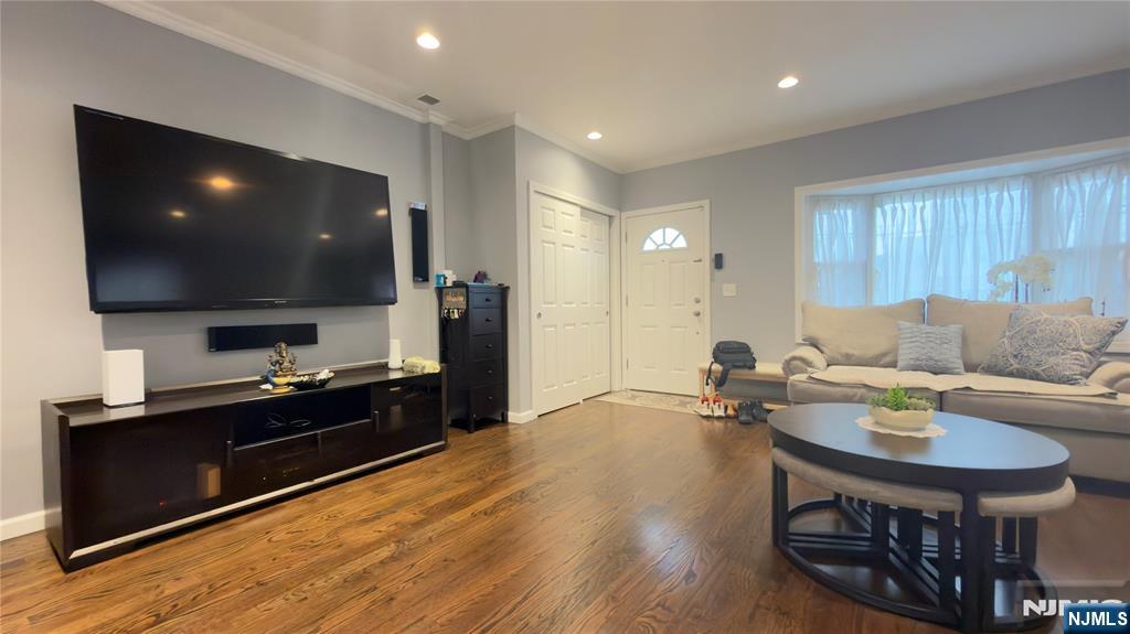 246 Harding Avenue Clifton, NJ 07011 - Photo 2 of 28 a living room with furniture and a flat screen tv