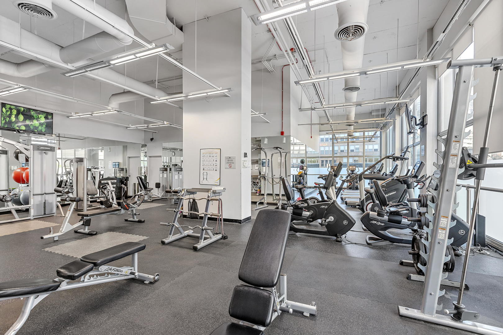 655 West Irving Park Road, Unit 4509 Chicago, IL 60613 - Photo 13 of 22 a view of a room with gym equipment
