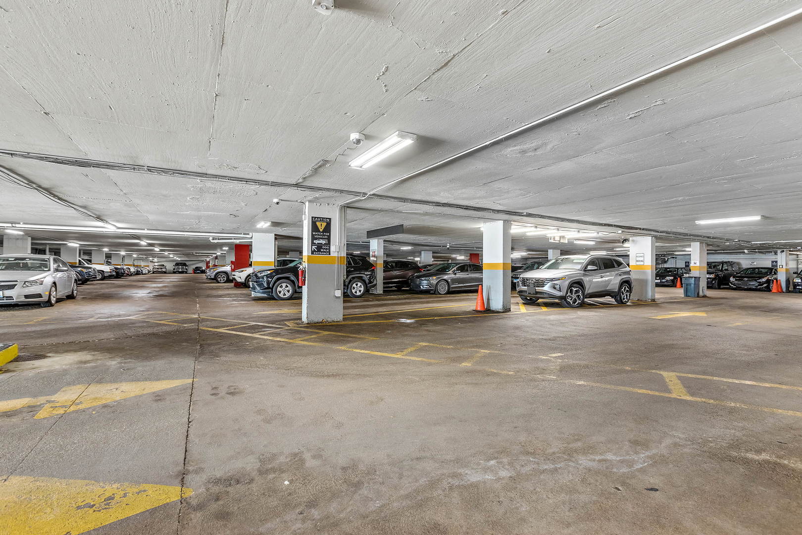 655 West Irving Park Road, Unit 4509 Chicago, IL 60613 - Photo 19 of 22 a view of parking with cars