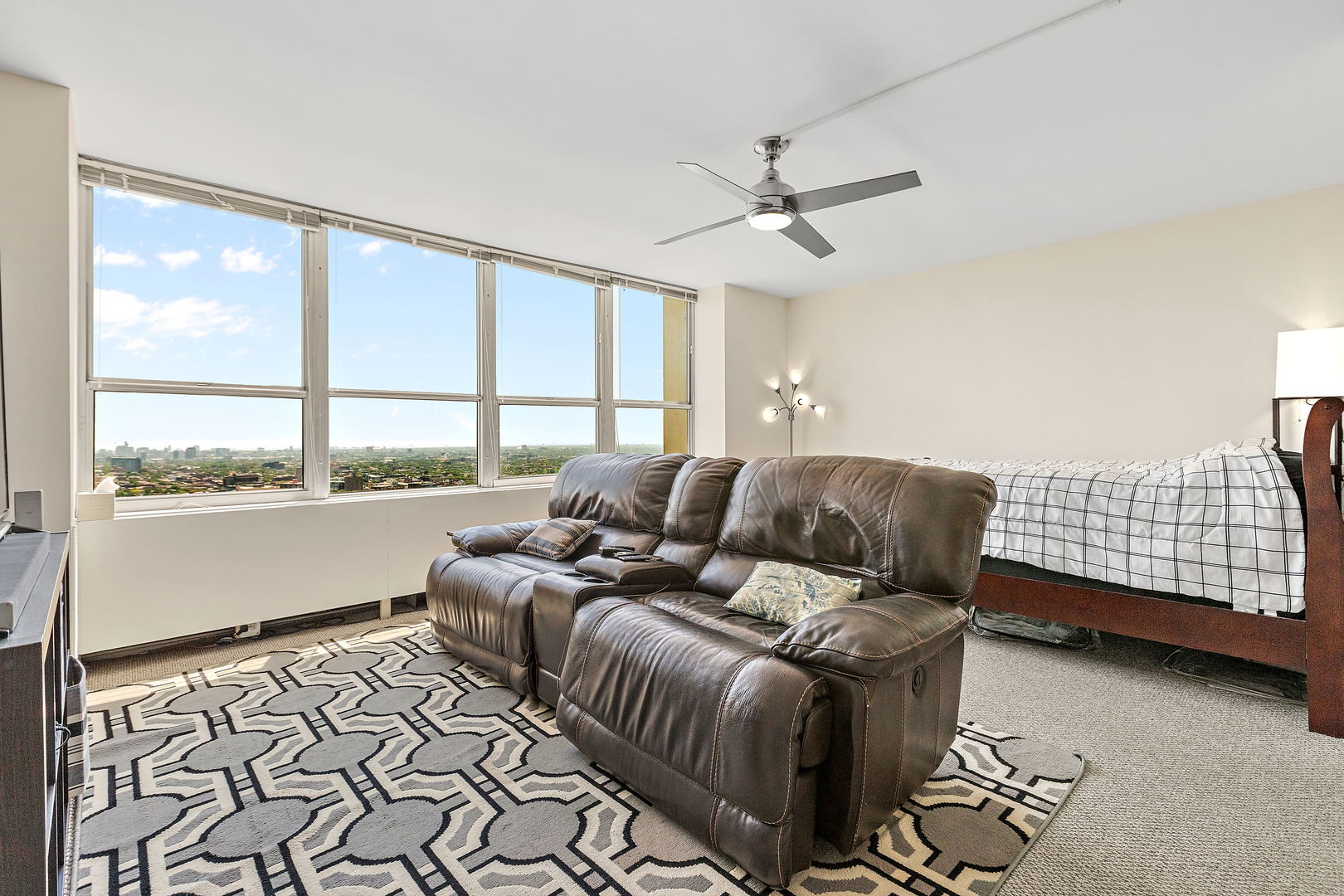 655 West Irving Park Road, Unit 4509 Chicago, IL 60613 - Photo 7 of 22 a living room with furniture and a large window