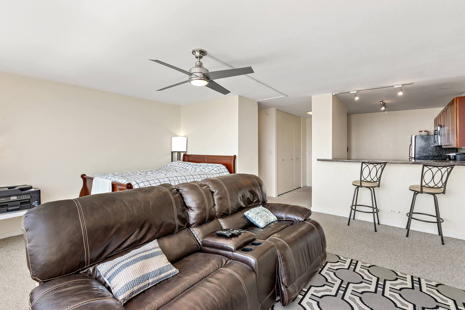 655 West Irving Park Road, Unit 4509 Chicago, IL 60613 - Photo 9 of 22 a bed room with a bed window and a couch