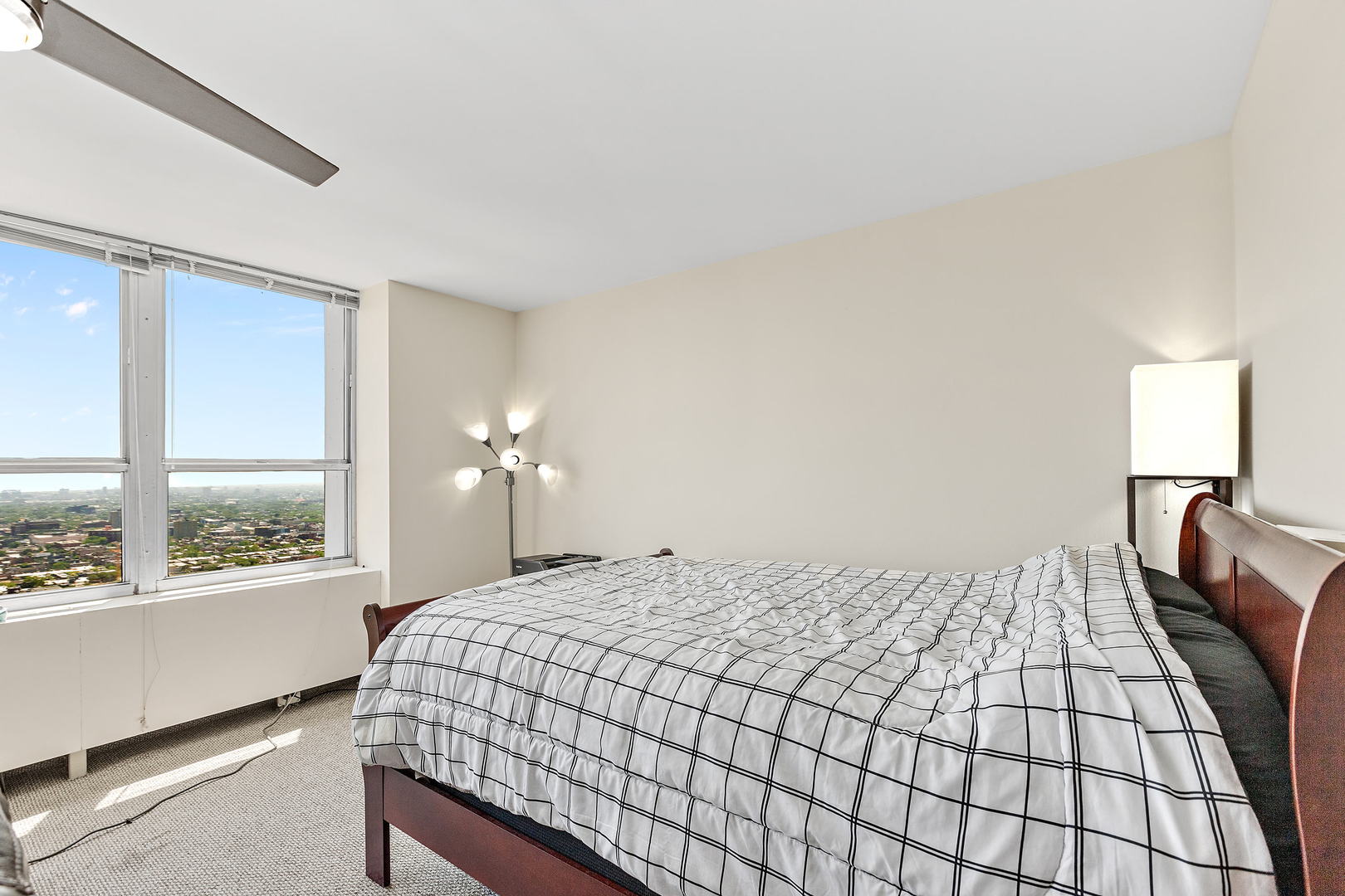 655 West Irving Park Road, Unit 4509 Chicago, IL 60613 - Photo 10 of 22 a bedroom with a bed and a large window