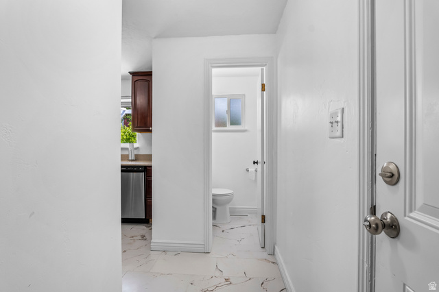 480 North 150 E Street Springville, UT 84663 - Photo 14 of 36 White-painted interior hallway with a door featuring brushed nickel hardware
