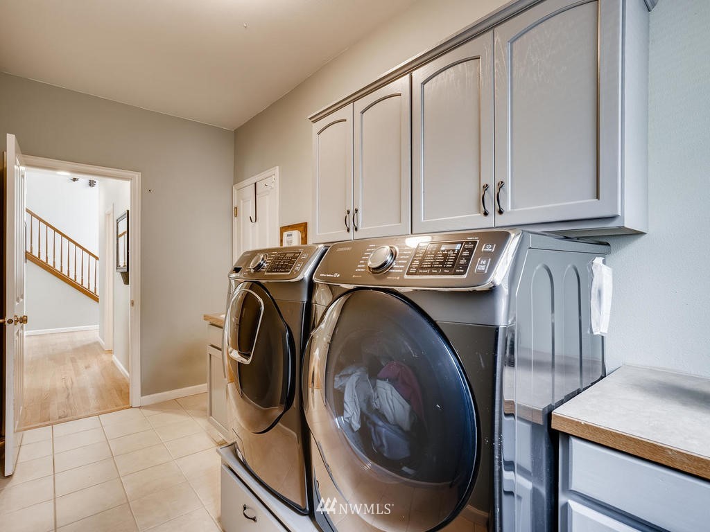 18718 Southeast 144th Street Renton, WA 98059 - Photo 20 of 25 a utility room with dryer and washer