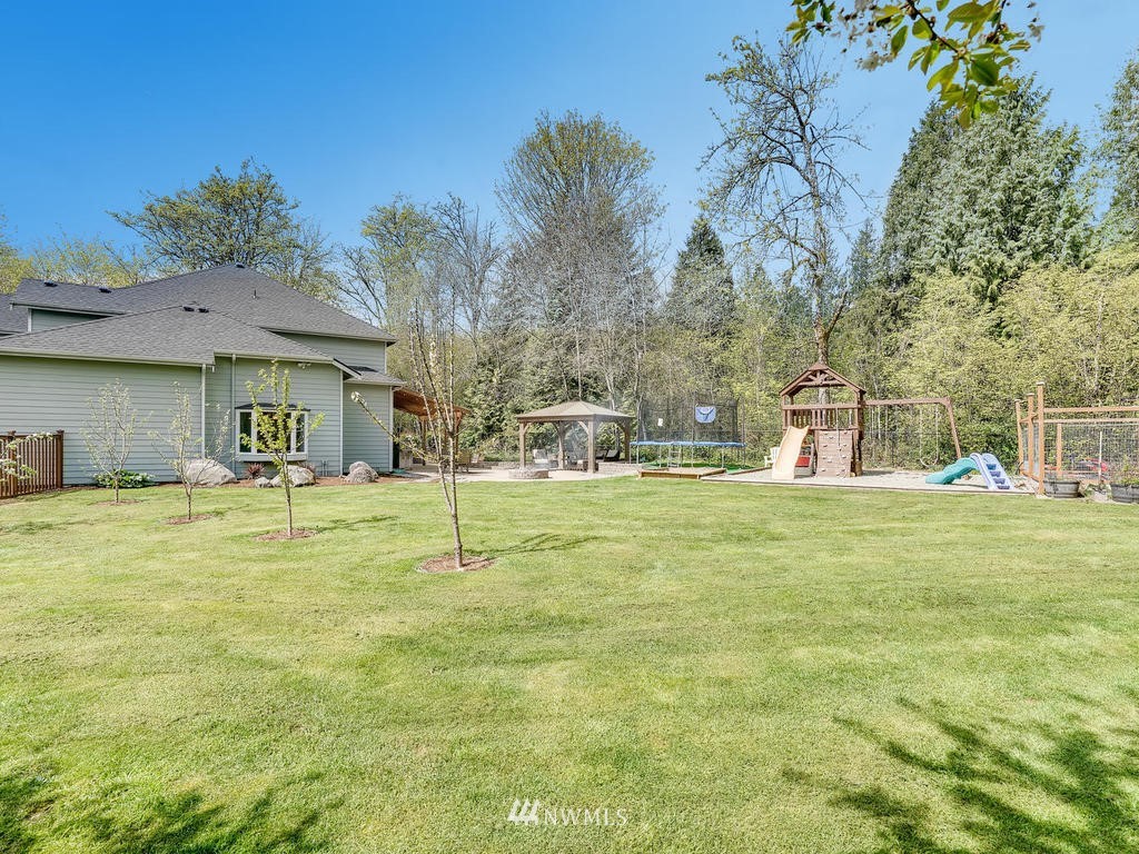 18718 Southeast 144th Street Renton, WA 98059 - Photo 22 of 25 a house view with swimming pool in front of it