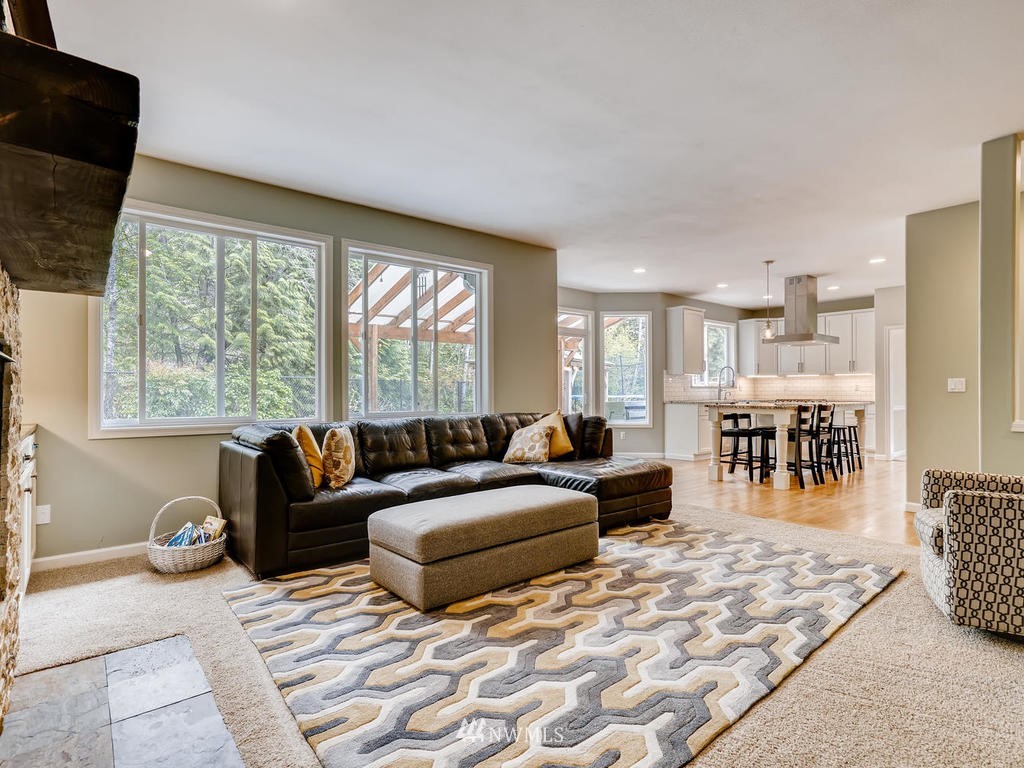 18718 Southeast 144th Street Renton, WA 98059 - Photo 7 of 25 a living room with furniture and a large window