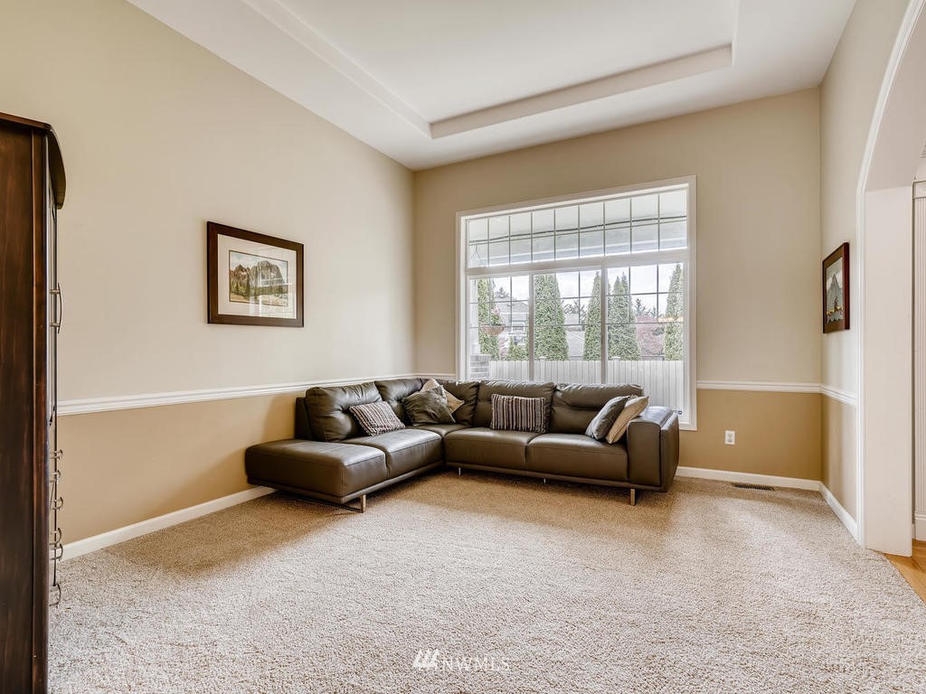 18718 Southeast 144th Street Renton, WA 98059 - Photo 8 of 25 a living room with furniture and a window
