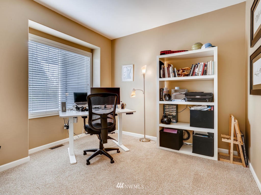 18718 Southeast 144th Street Renton, WA 98059 - Photo 10 of 25 a view of a workspace with furniture and a window