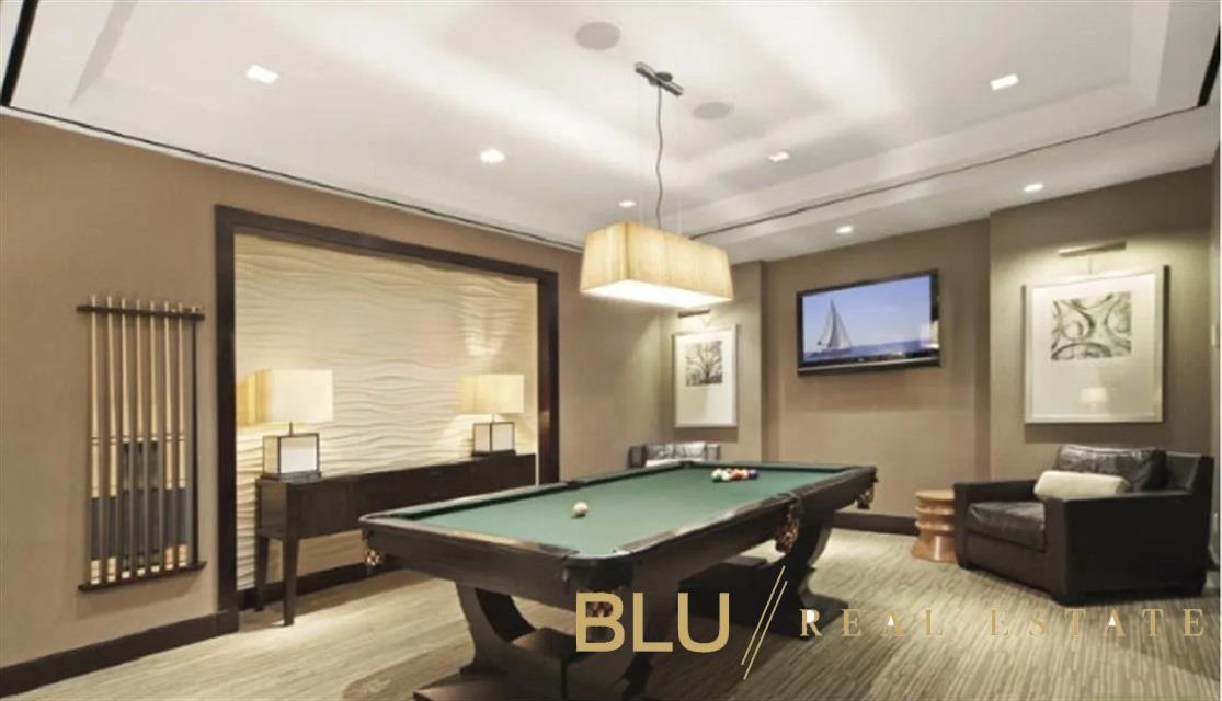 100 Riverside Boulevard, Unit 23D Manhattan, NY 10069 - Photo 10 of 13 a room with furniture pool table wooden floor and windows