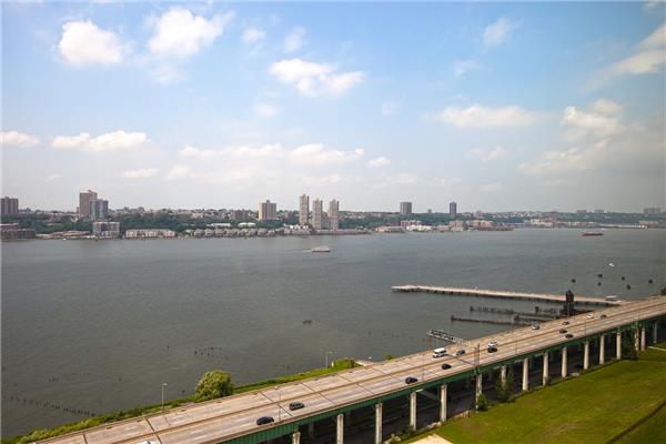 100 Riverside Boulevard, Unit 23D Manhattan, NY 10069 - Photo 4 of 13 a view of a lake with a city view
