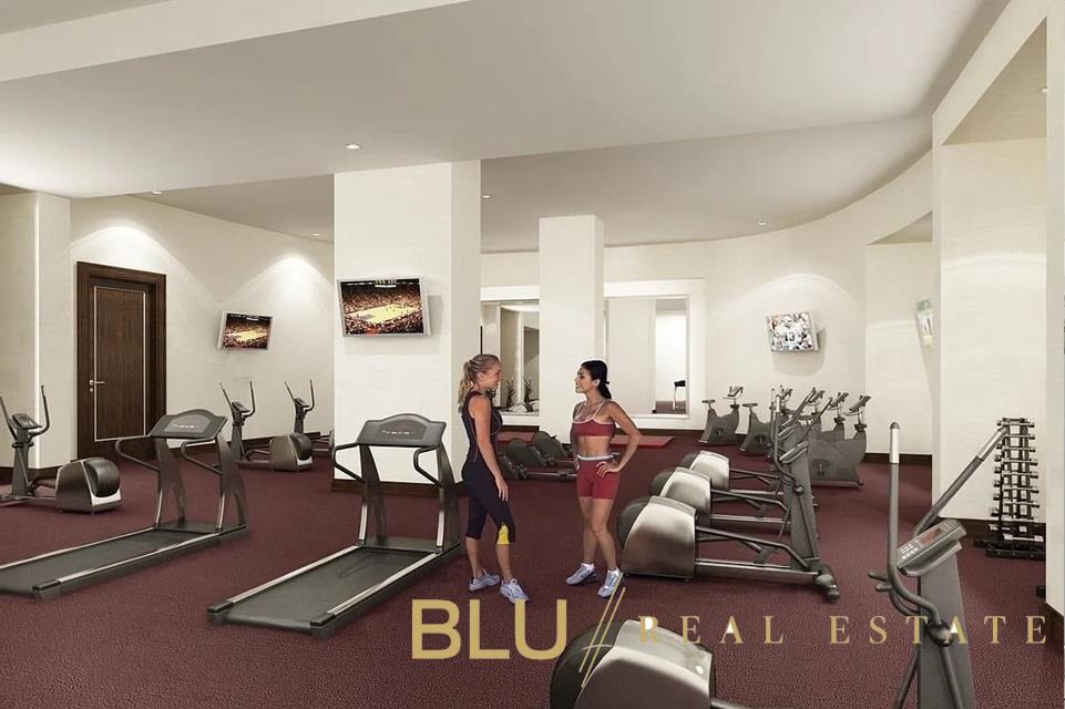 100 Riverside Boulevard, Unit 23D Manhattan, NY 10069 - Photo 9 of 13 a room with gym equipment and large mirror