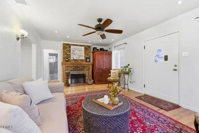 a living room with furniture and a fireplace