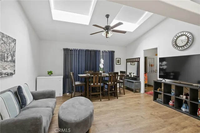 a kitchen with kitchen island a dining table and chairs