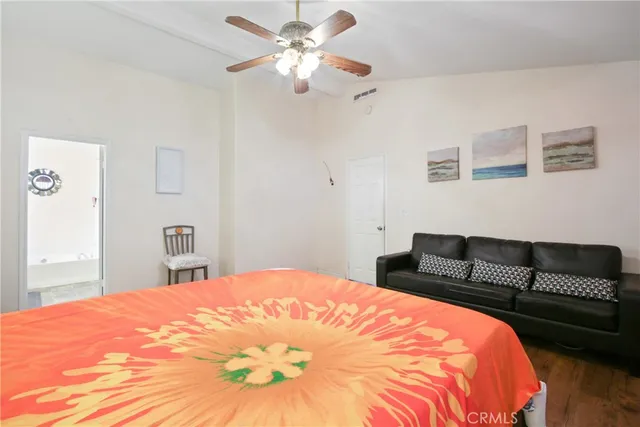 a bathroom with a bathtub sink and mirror
