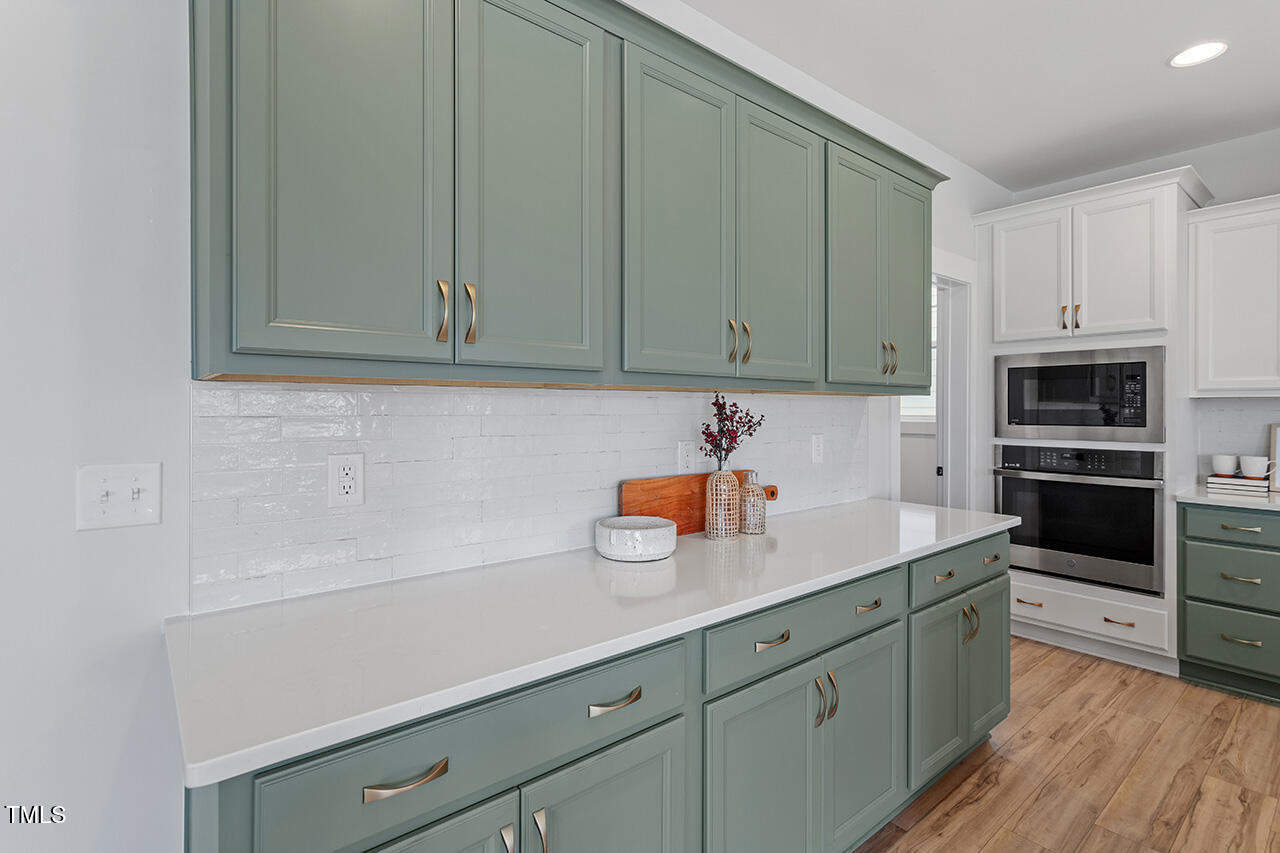 539 Vine Parkway Pittsboro, NC 27312 - Photo 13 of 35 a kitchen with granite countertop cabinets stainless steel appliances and a sink