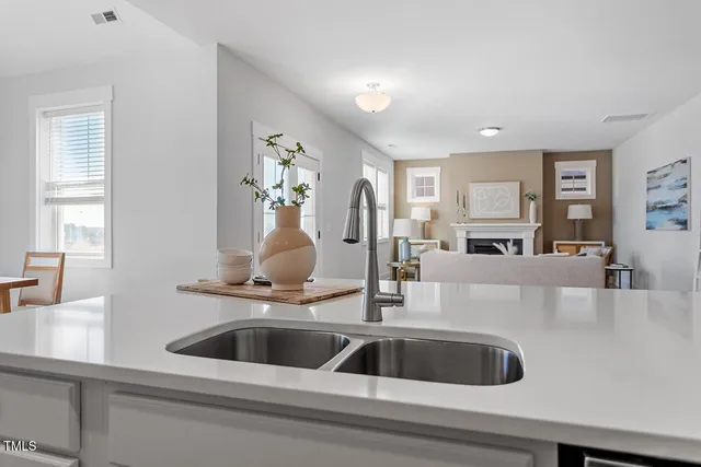 a white toilet sitting next to a bathroom sink