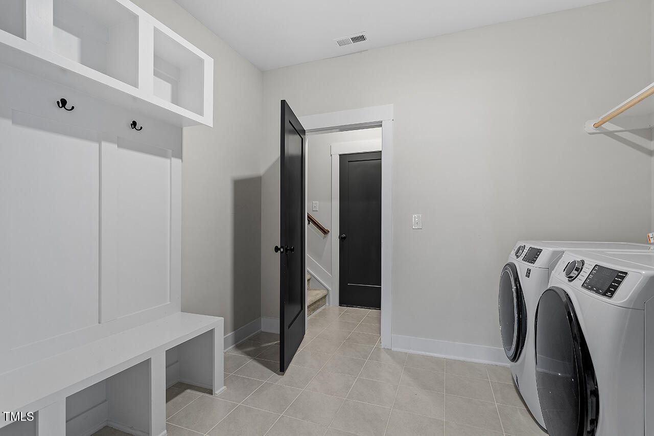 539 Vine Parkway Pittsboro, NC 27312 - Photo 20 of 35 a view of walk in closet with clothes and dryer
