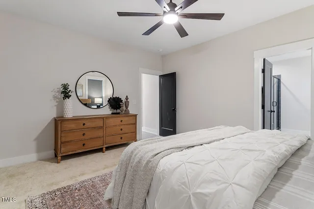 a bathroom with a double vanity sink a mirror and a bathtub
