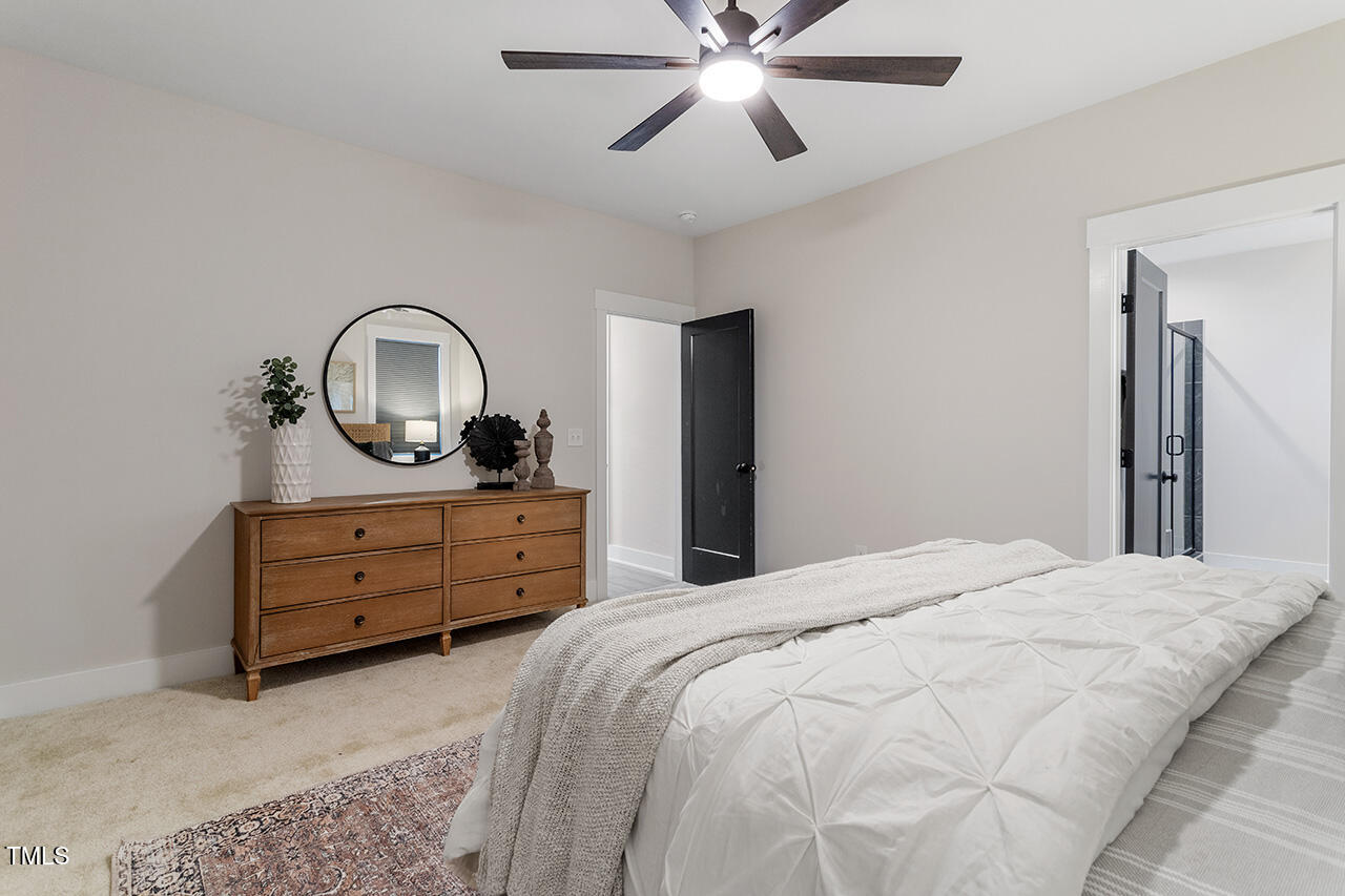 539 Vine Parkway Pittsboro, NC 27312 - Photo 22 of 35 a bedroom with a bed and a dresser