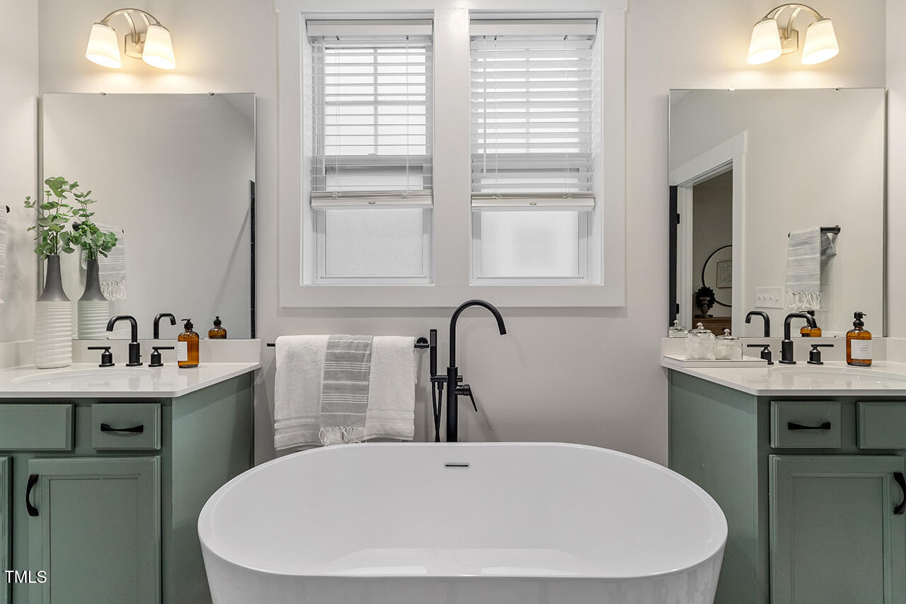 539 Vine Parkway Pittsboro, NC 27312 - Photo 25 of 35 a bathroom with a sink and a mirror