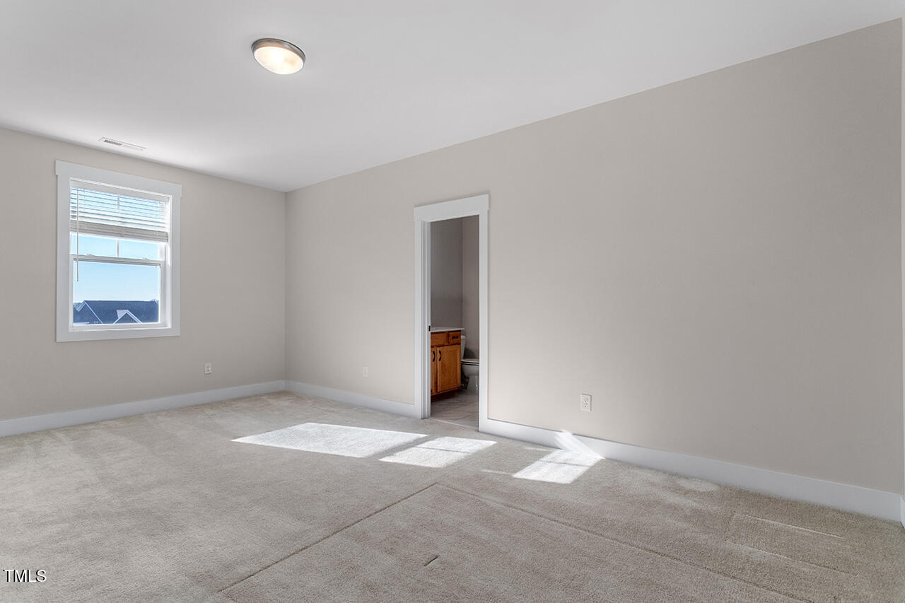 539 Vine Parkway Pittsboro, NC 27312 - Photo 26 of 35 an empty room with windows and closet