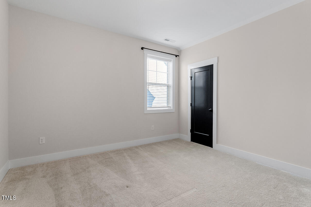 539 Vine Parkway Pittsboro, NC 27312 - Photo 29 of 35 an empty room with windows and closet