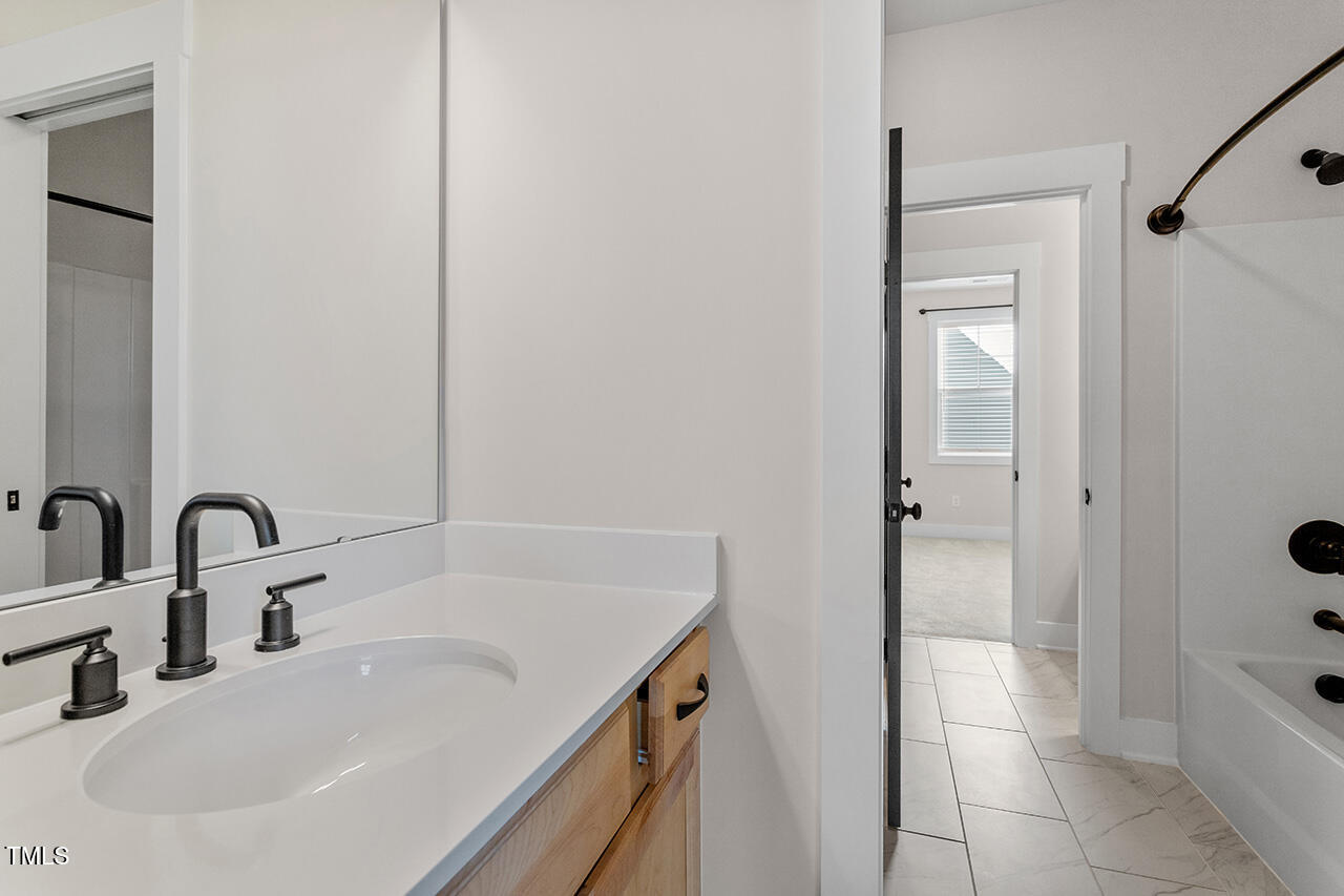 539 Vine Parkway Pittsboro, NC 27312 - Photo 30 of 35 a bathroom with a sink and a tub