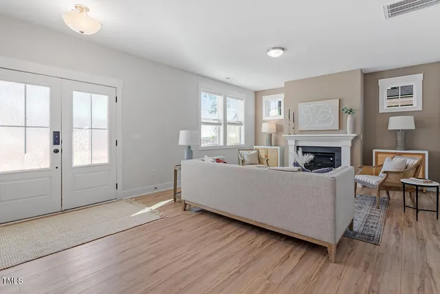 a living room with furniture and a fireplace