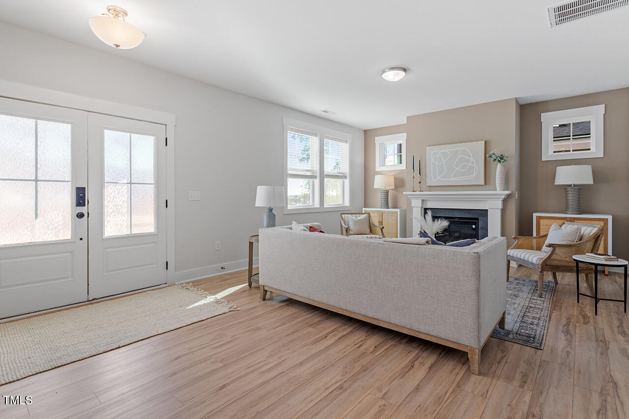 539 Vine Parkway Pittsboro, NC 27312 - Photo 5 of 35 a living room with furniture and a fireplace