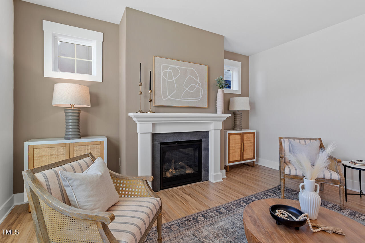 539 Vine Parkway Pittsboro, NC 27312 - Photo 8 of 35 a living room with furniture a window and a fireplace